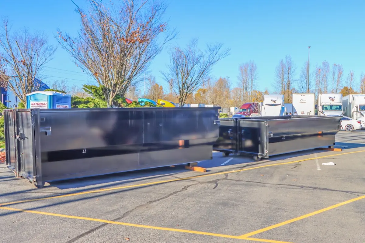 Professional dumpster rental service with roll-off container on residential driveway in Normandy Park
